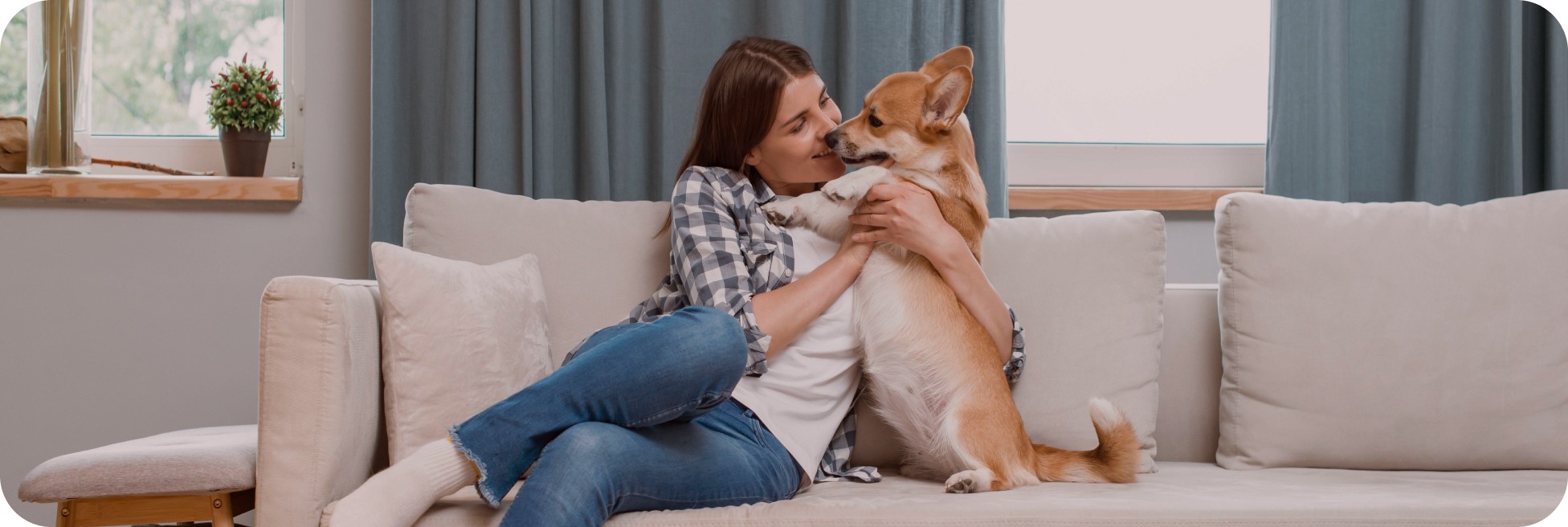 Woman with dog on couch